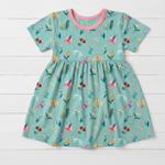 Short sleeve girls' dress in a bloom and bug print, made from bamboo viscose blend fabric
