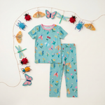 Two-piece baby pajama set with bloom and bug print, matching top and bottoms