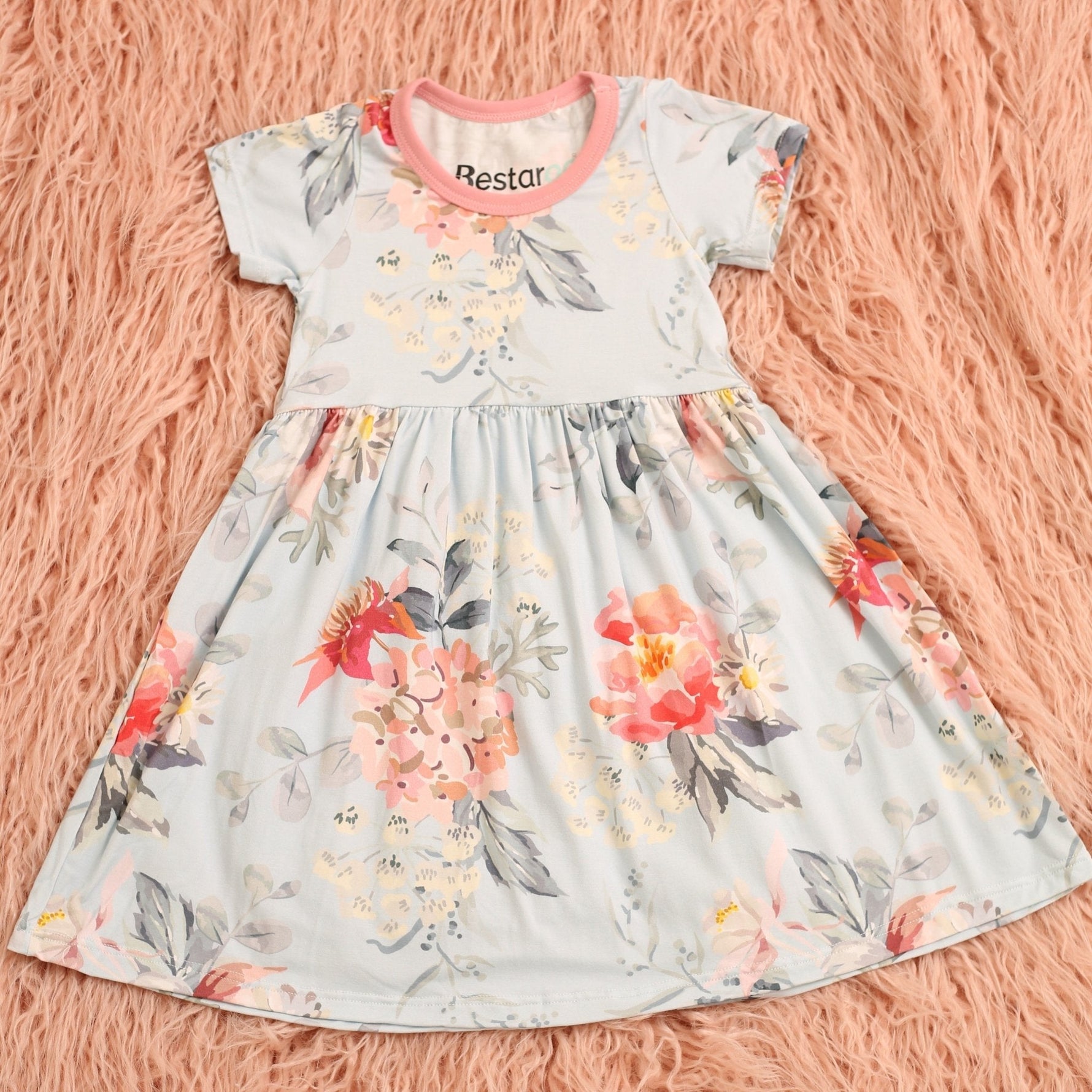 Short-sleeve toddler dress in soft pink with a blossom pattern and full twirl skirt