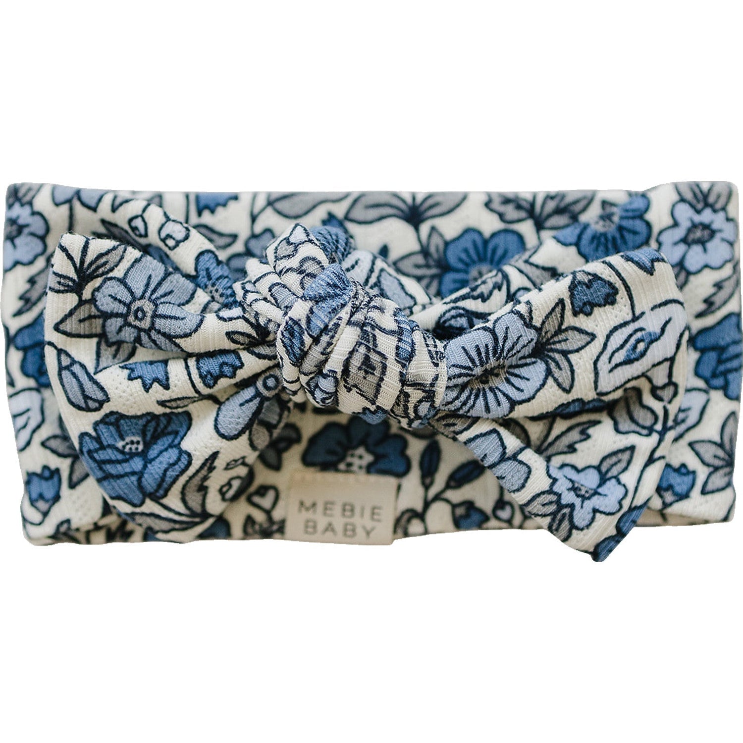 Baby head wrap in bluebell with a pointelle pattern and a knotted bow at the top