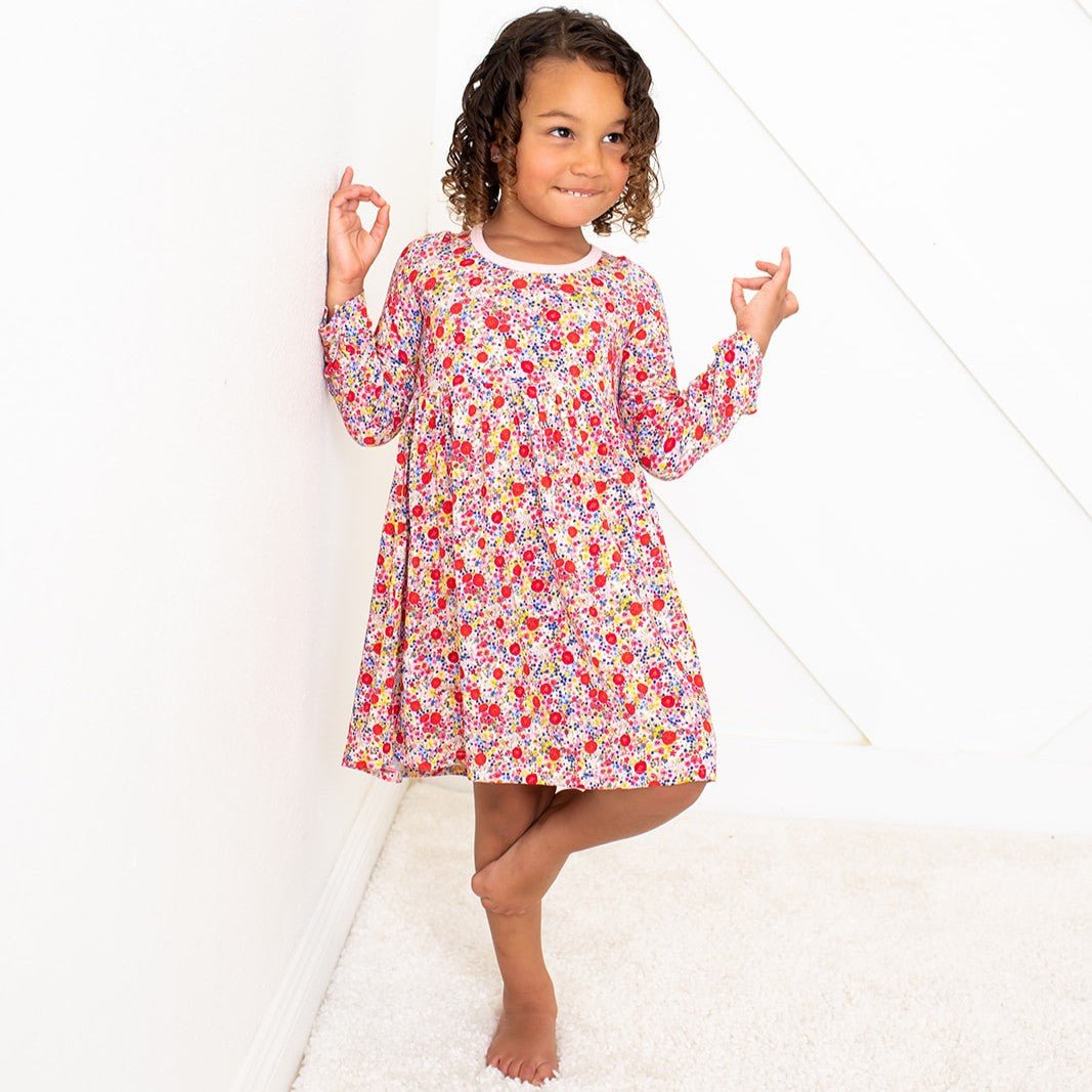 Long-sleeve toddler dress in blush pink with a floral bloom print