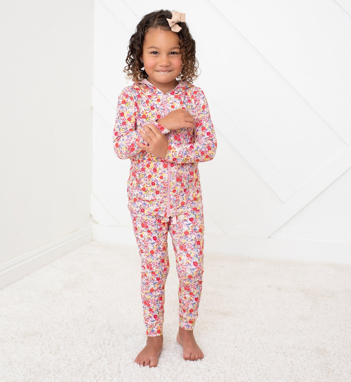 Relaxed fit baby joggers in blush with an all-over floral print, elastic drawstring waist and tapered legs.