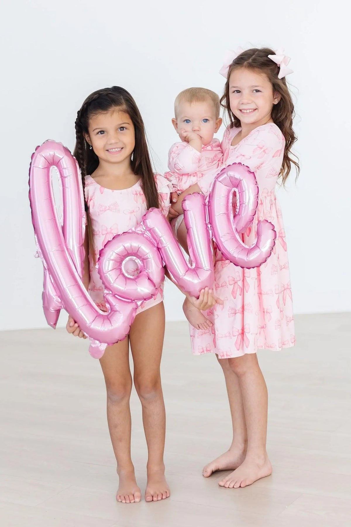 Mila & Rose ® Blushing Bows 3/4 Sleeve Twirl Bodysuit - 