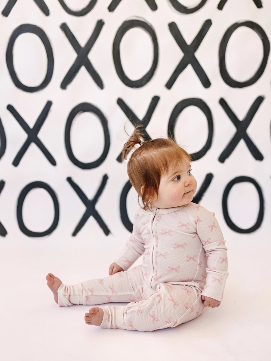 Little Joy Co. Blushing Bows Ribbed Bamboo Zippy Romper With Foldover Feet - Everetts Place Boutique - 