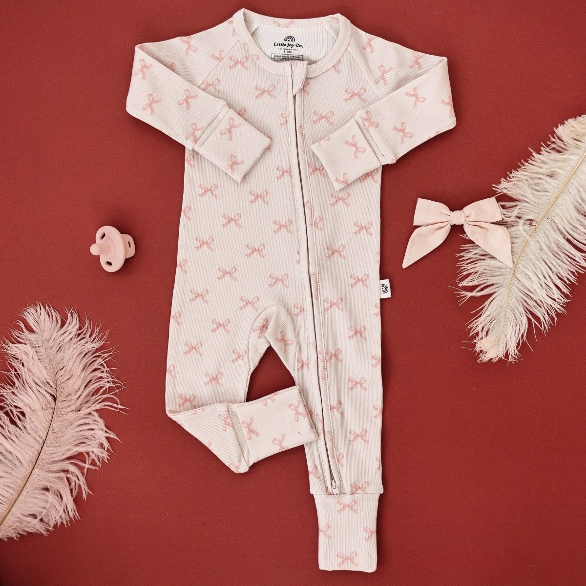 Little Joy Co. Blushing Bows Ribbed Bamboo Zippy Romper With Foldover Feet - Everetts Place Boutique - 