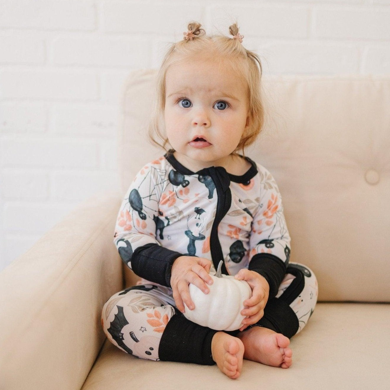 Bamboo zippy romper pajamas in a black Halloween Boo Bash print with foldover feet cuffs.