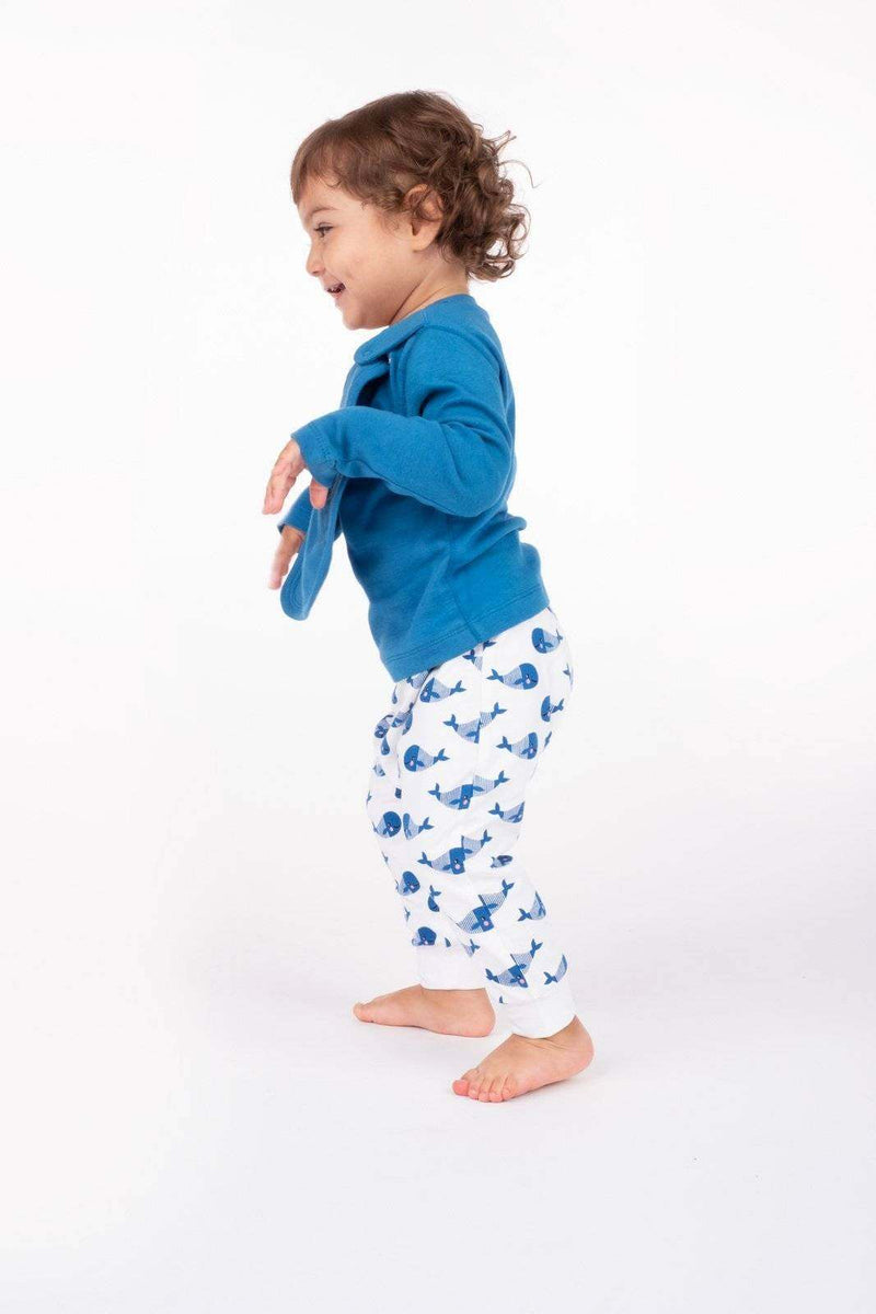 Toddler wearing Boo Boo Harem Pants with blue whale print.