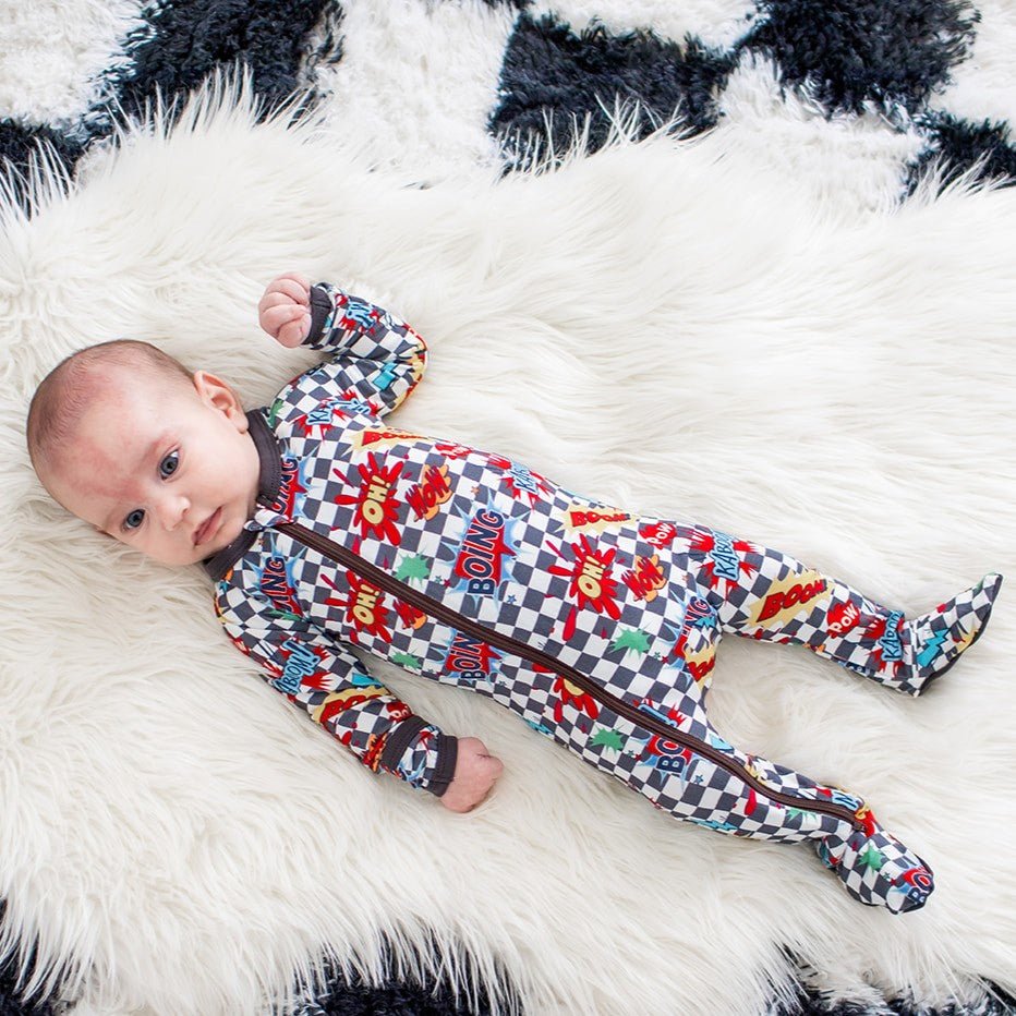 Baby footie pajamas in a checkered pattern with playful print, fold-over mittens, and a full-length front zipper.