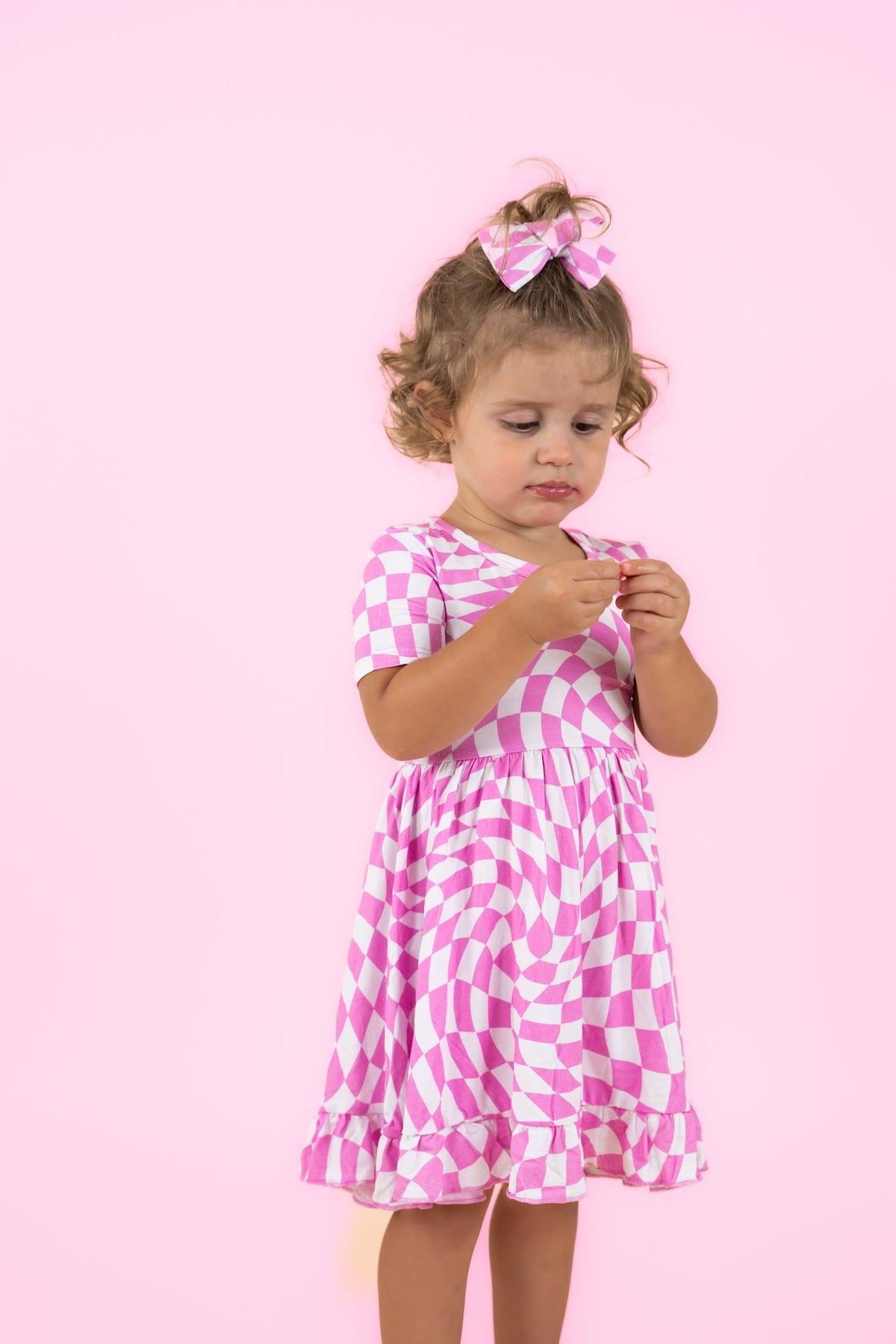 DREAM BIG LITTLE CO BUBBLEGUM WAVY CHECKERS DREAM RUFFLE DRESSEveretts Place
