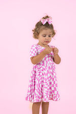 DREAM BIG LITTLE CO BUBBLEGUM WAVY CHECKERS DREAM RUFFLE DRESSEveretts Place