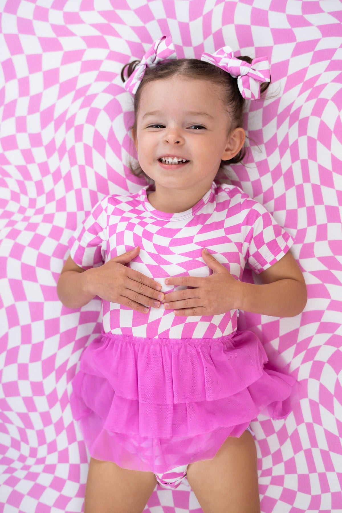 DREAM BIG LITTLE CO BUBBLEGUM WAVY CHECKERS DREAM TUTU BODYSUIT DRESSEveretts Place
