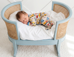 Baby footie pajamas in a builders construction print with a full-length two-way front zipper
