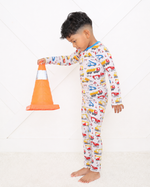 Two-piece long sleeve pajama set with builders construction print top and matching pants