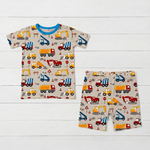 Two-piece kids pajama set with short sleeve top and matching shorts in a builders construction print