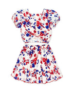 Toddler two-piece skirt set with puff-sleeve top in white with a red floral print