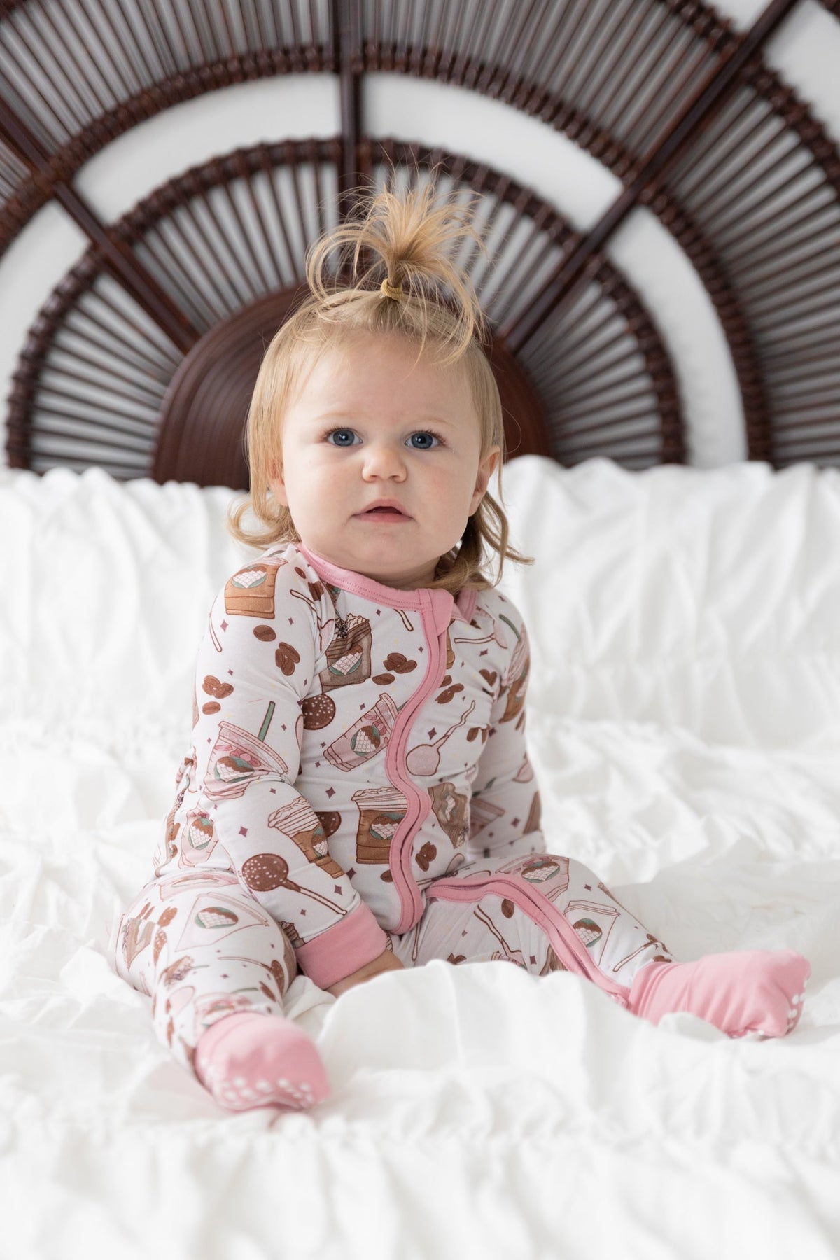Baby zip romper pajamas in a sweet dessert-inspired print with fold-over feet.