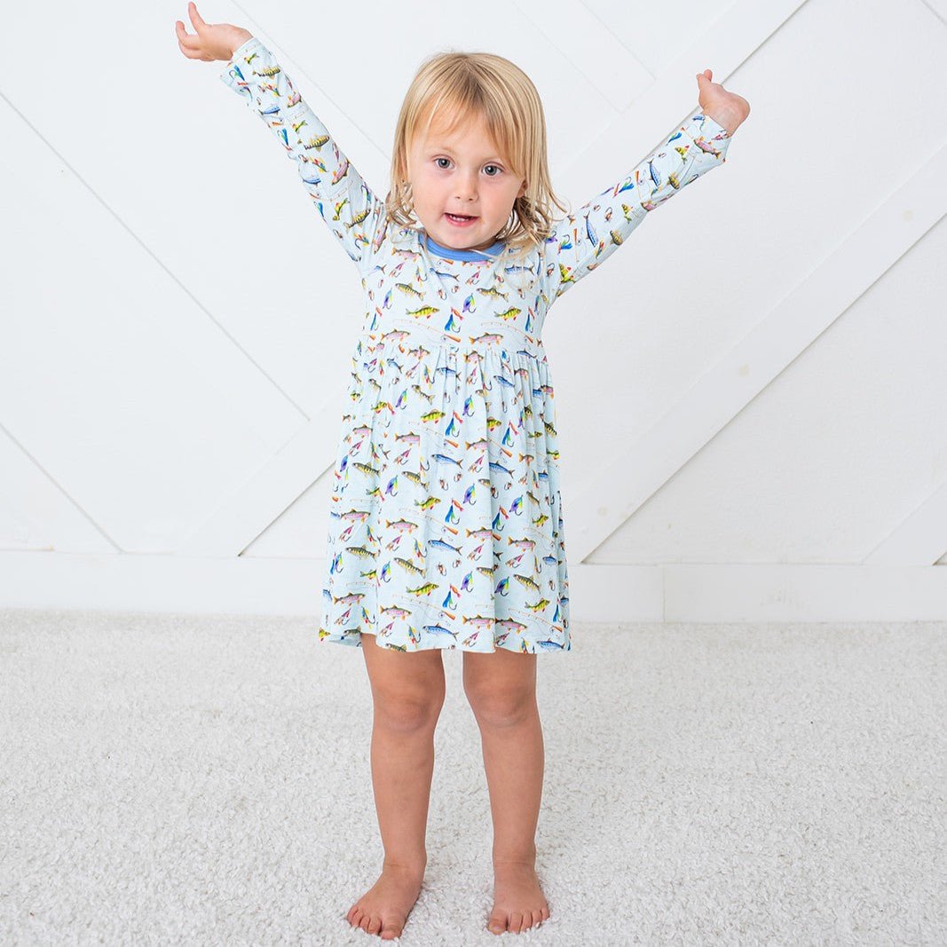 Long sleeve baby dress with a colorful fish print all over