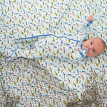 Baby footie pajamas with a colorful fall fish print, a full-length two-way zipper, and covered feet.