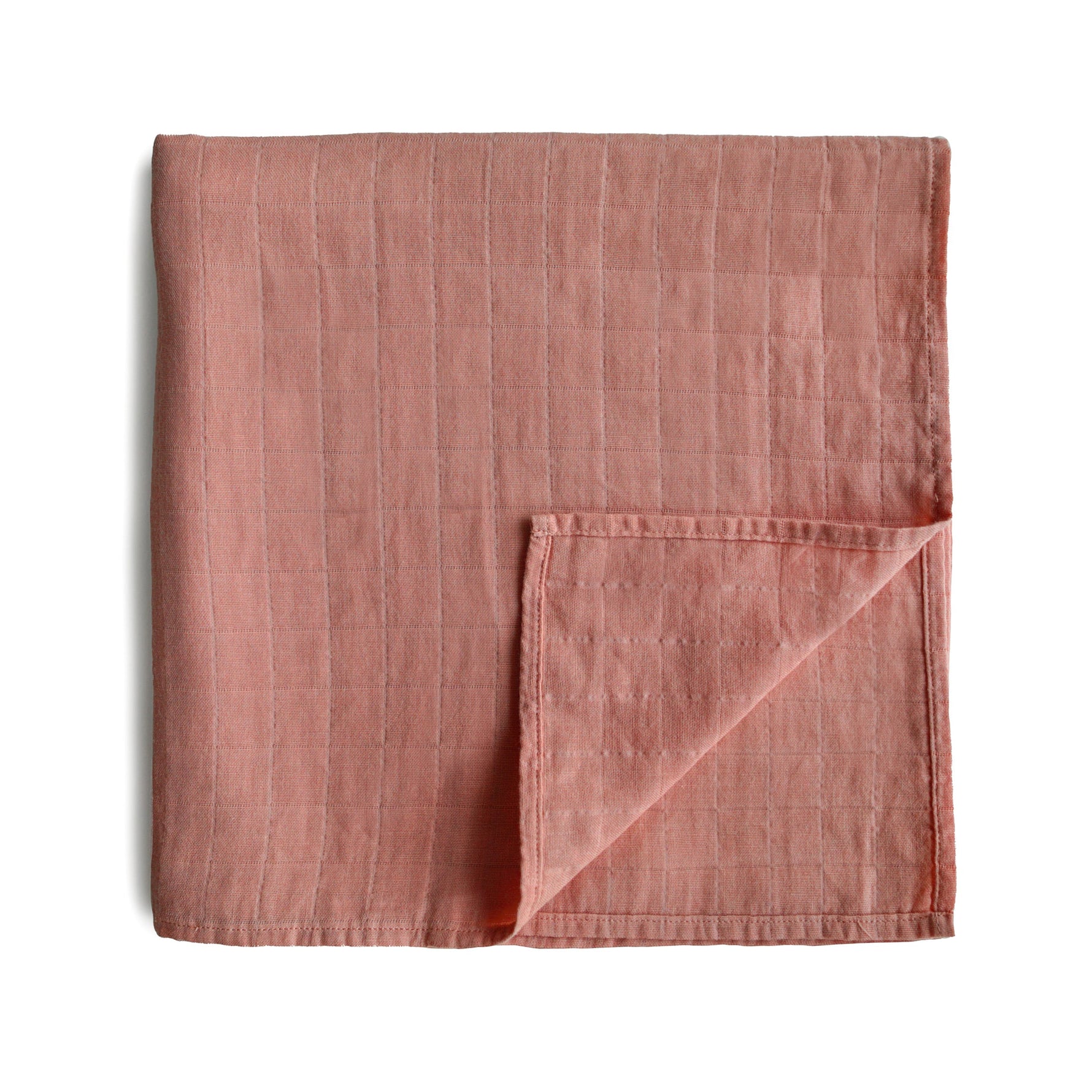 Soft Mushie organic cotton muslin baby swaddle blanket.