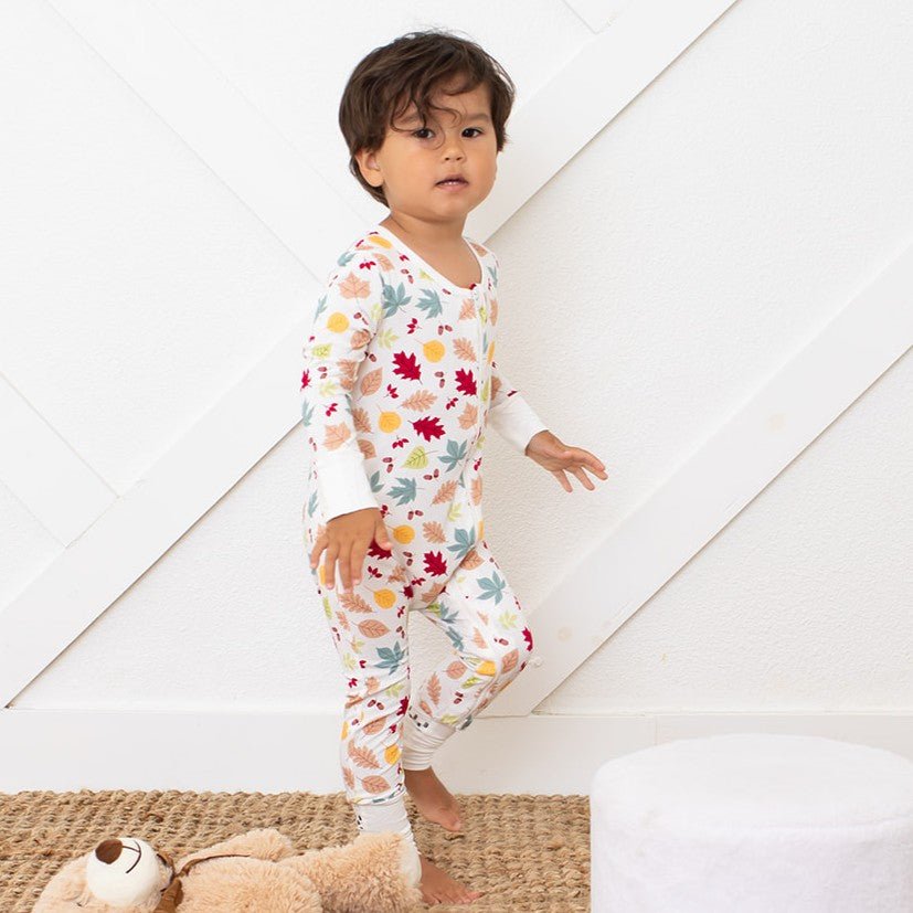 Baby convertible coverall in soft fabric with a whimsical autumn leaves print and a full-length two-way zipper