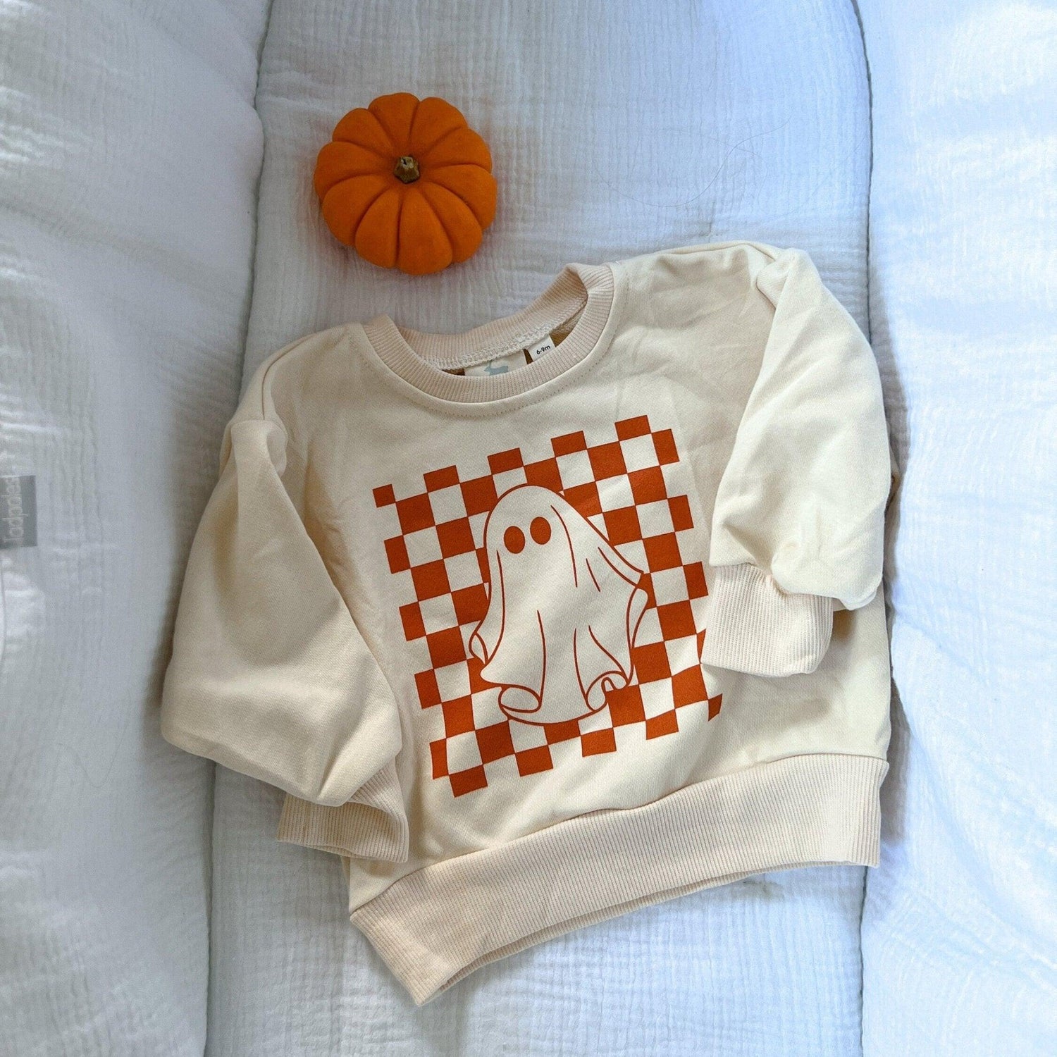 Oversized crewneck sweatshirt with a retro checkered ghost graphic on the front
