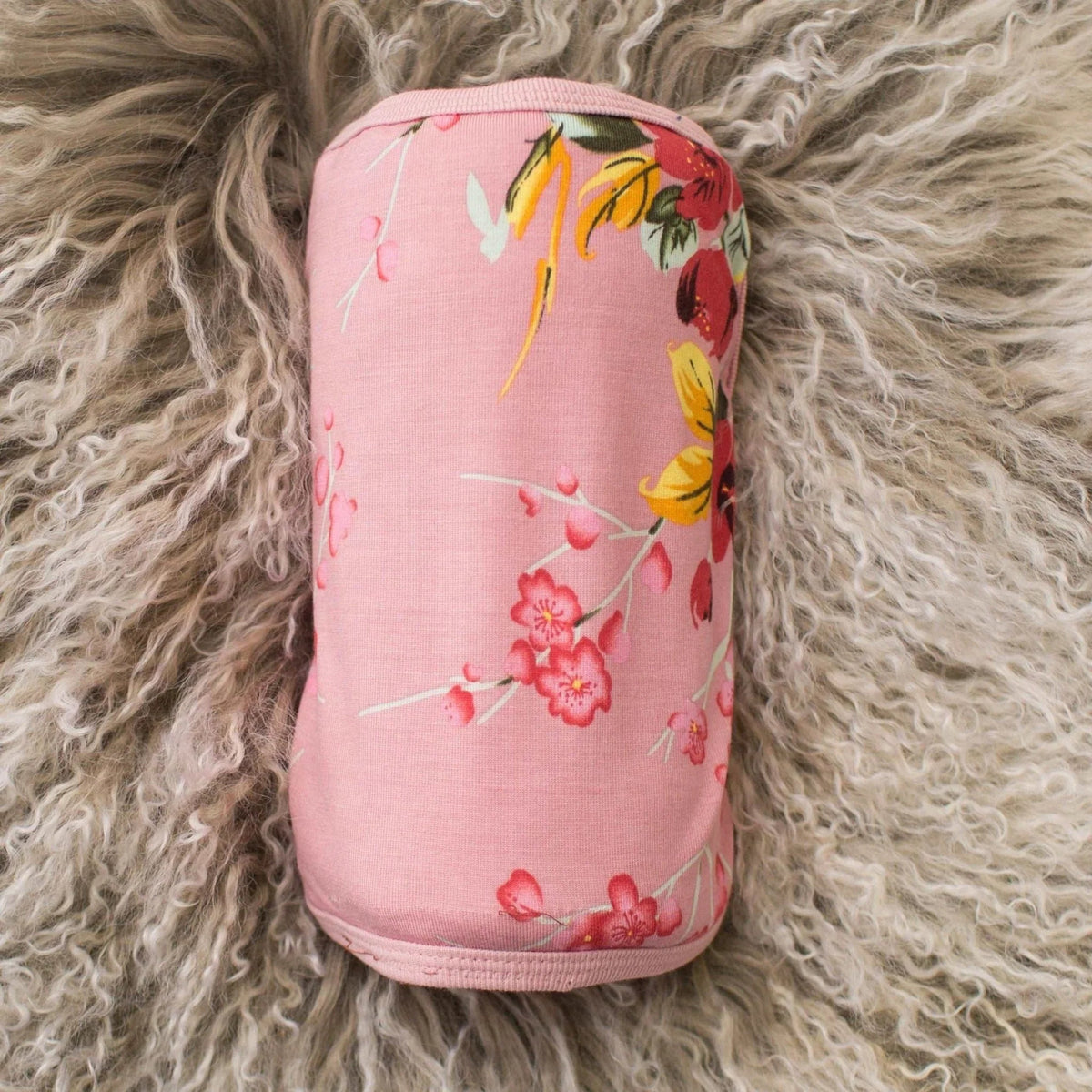 Baby swaddle blanket with a pink cherry blossom rose floral pattern
