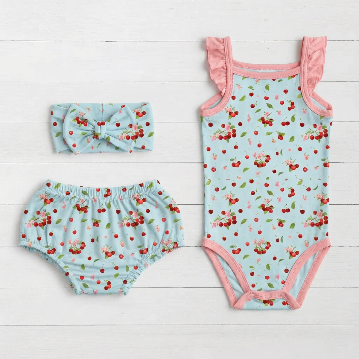 Baby set with cherry print bodysuit, ruffle-back bloomers with elastic waist, and matching headband