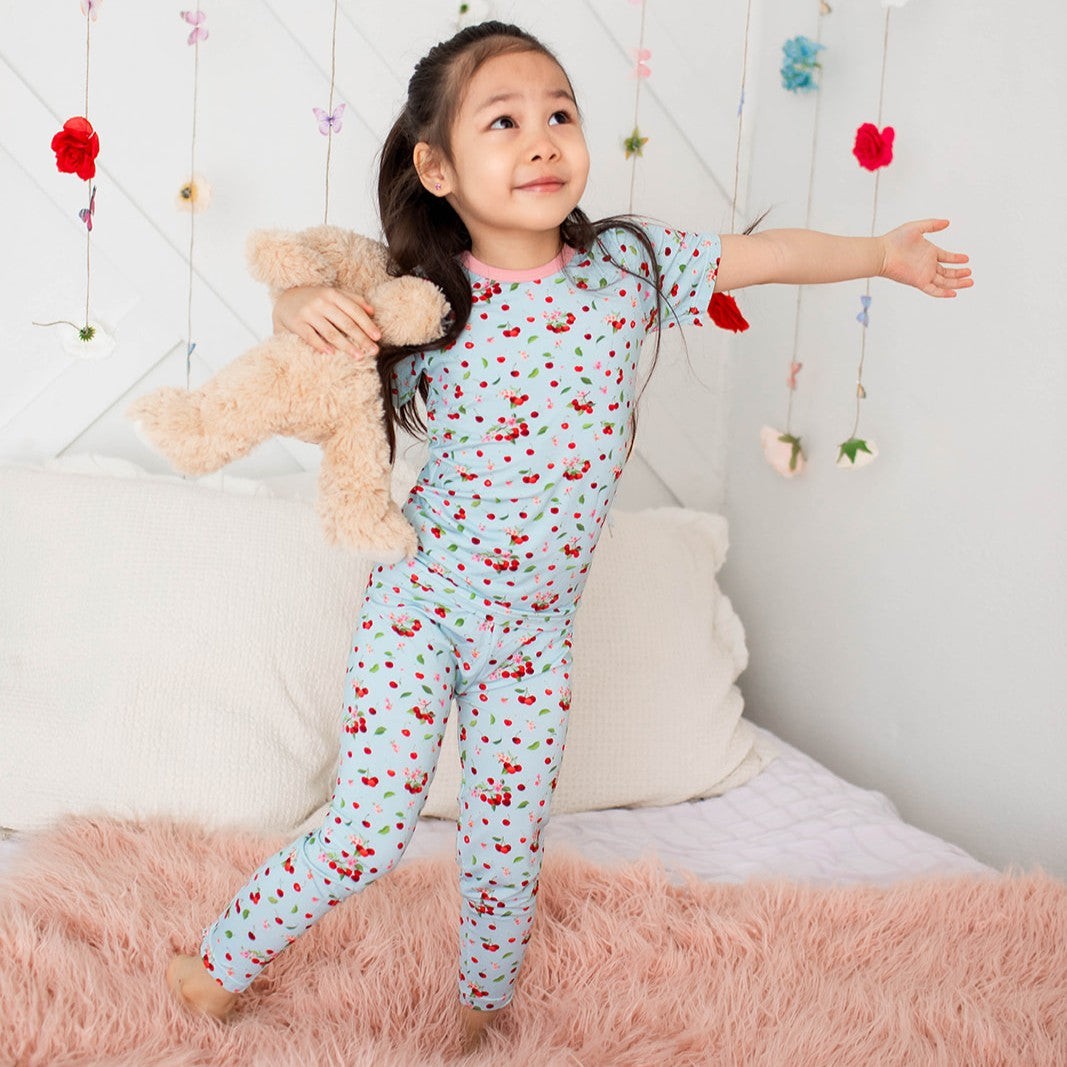 Two-piece short sleeve pajama set with cherry print, matching long pants