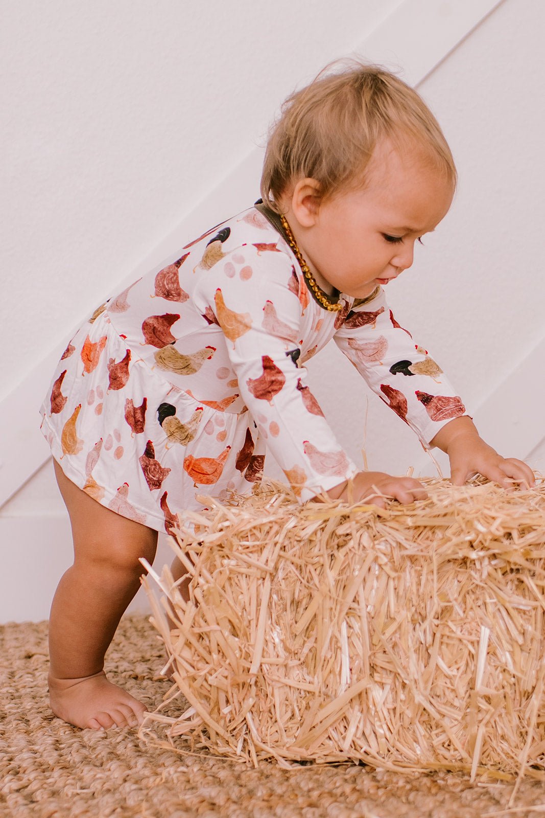 Long-sleeve bodysuit dress in the Cooped Up & Cozy print with snaps at the inseam