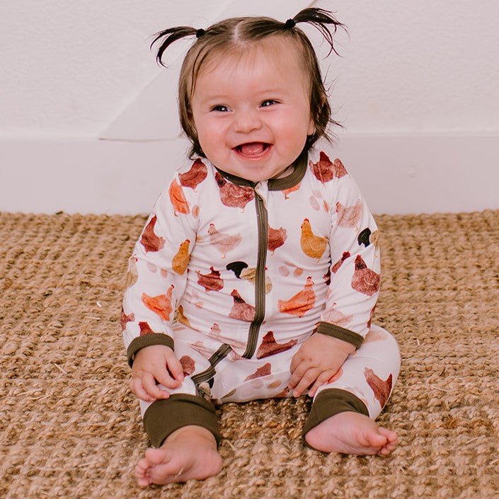 Baby coverall styled like a chicken with a front zipper and cuffed ankles.