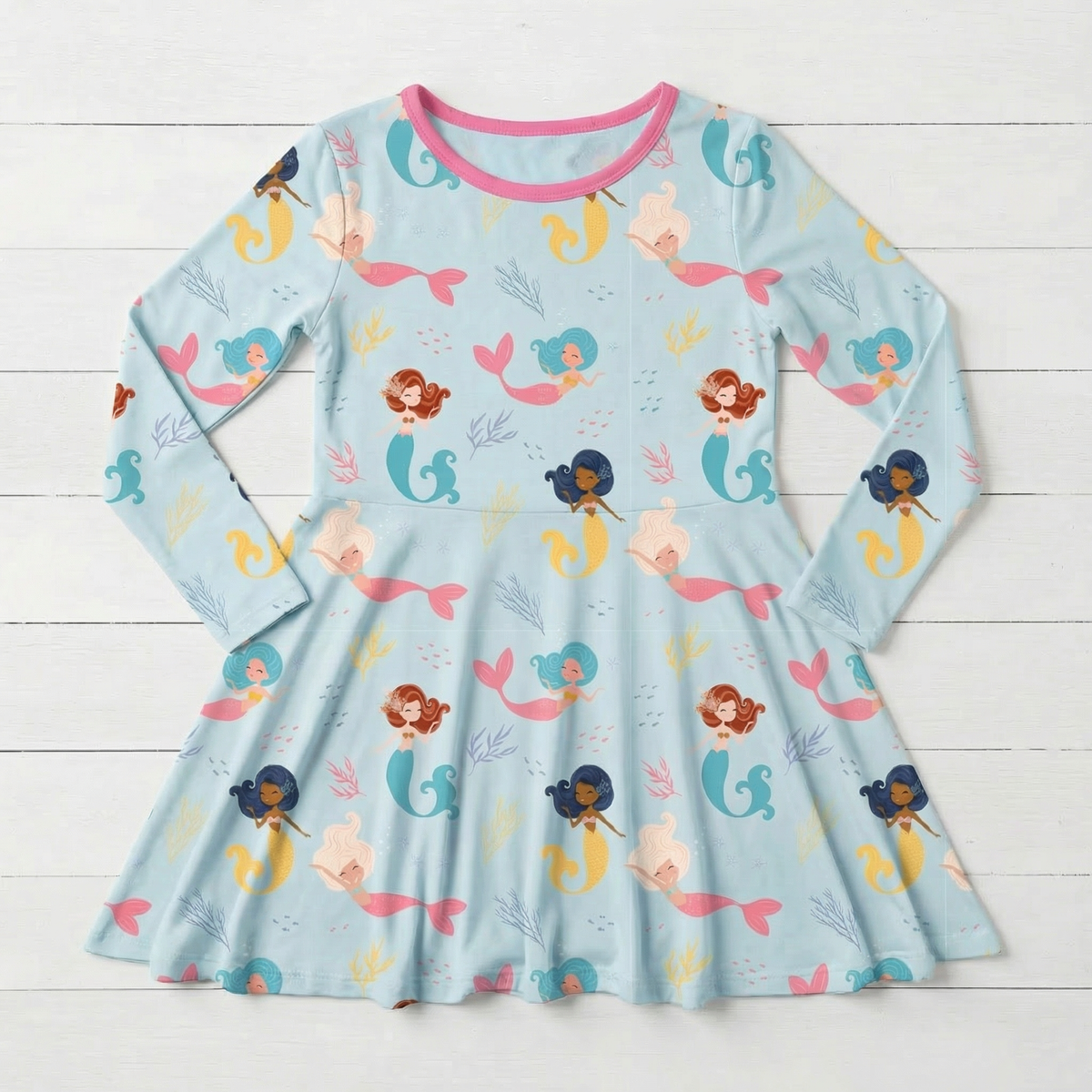 Long sleeve toddler twirl dress in coral with a full skirt, made from bamboo and spandex fabric