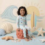 Two-piece long sleeve baby pajama set in coral print with matching pants