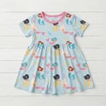 Short sleeve girls dress in a coral print, made from bamboo viscose blend fabric