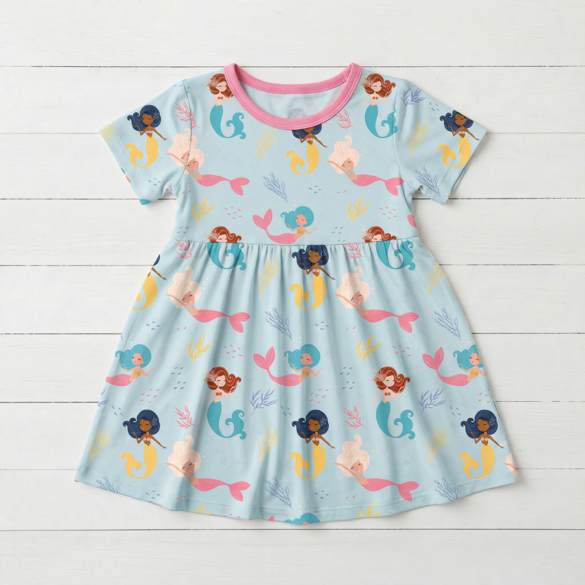 Short sleeve girls dress in a coral print, made from bamboo viscose blend fabric