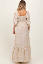 Model wearing a PinkBlush Cream Floral Sweetheart Neckline Maternity Maxi Dress, posing gracefully.