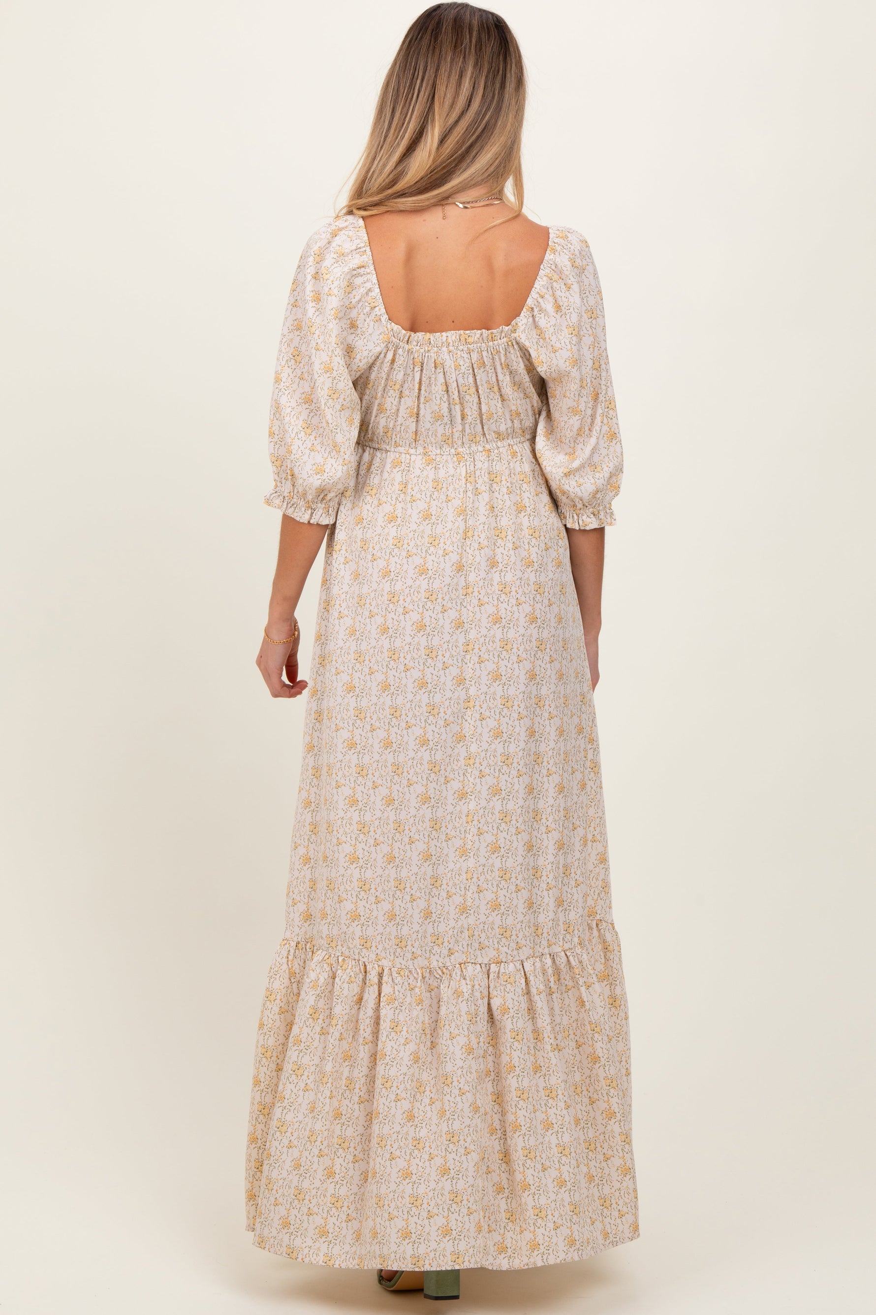 Model wearing a PinkBlush Cream Floral Sweetheart Neckline Maternity Maxi Dress, posing gracefully.
