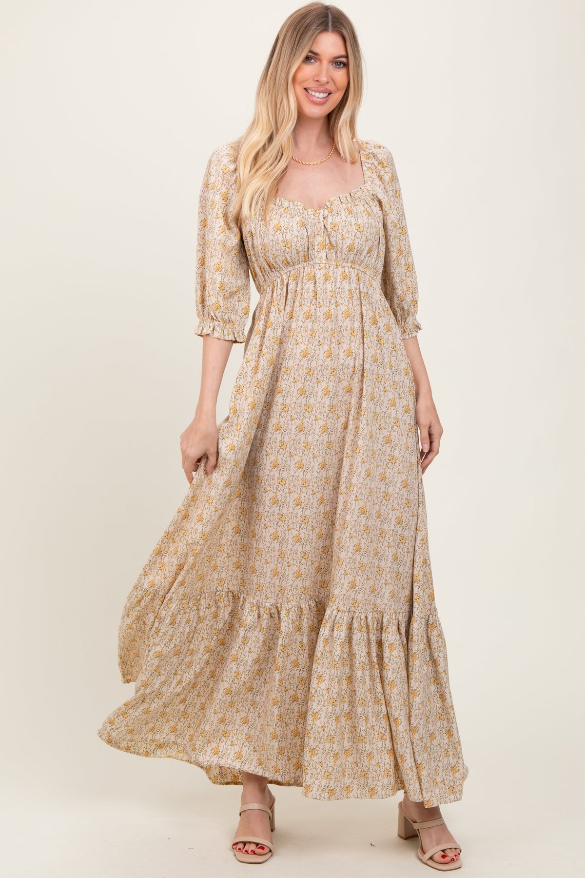 Model wearing a PinkBlush Cream Floral Sweetheart Neckline Maternity Maxi Dress, posing gracefully.
