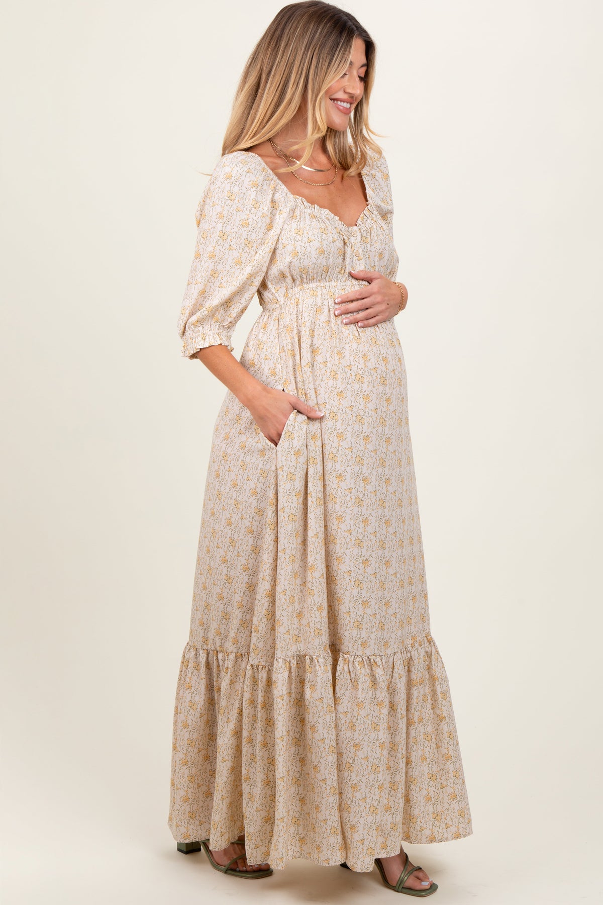 Model wearing a PinkBlush Cream Floral Sweetheart Neckline Maternity Maxi Dress, posing gracefully.