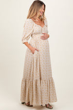 Model wearing a PinkBlush Cream Floral Sweetheart Neckline Maternity Maxi Dress, posing gracefully.