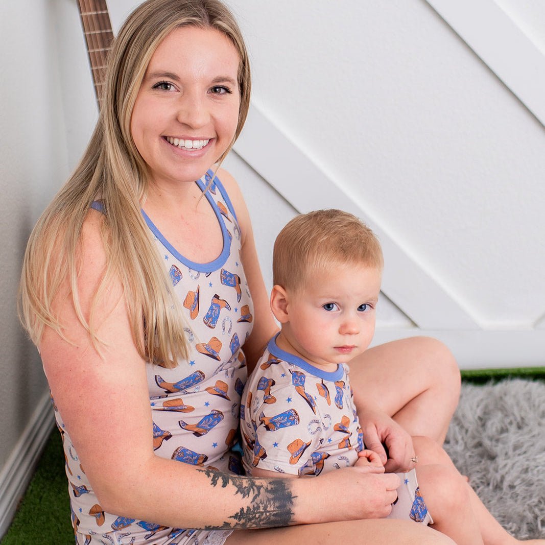 Women's two-piece tank top and shorts loungewear set with a cowboy print and lace ruffle trim on the shorts