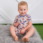 Two-piece short-sleeve baby pajama set with a cowboy-themed print, short sleeves, and matching shorts.