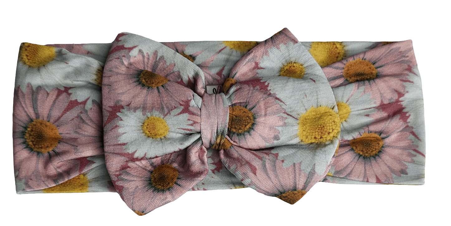 Bamboo headband bow with a daisy floral print, sized for infants and children.