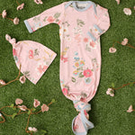 Baby gown and matching hat in a pink ditzy floral print with fold-over mitten cuffs and a knotted bottom