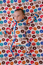 Baby footie pajamas in a playful chicken print with a full-length front zipper.