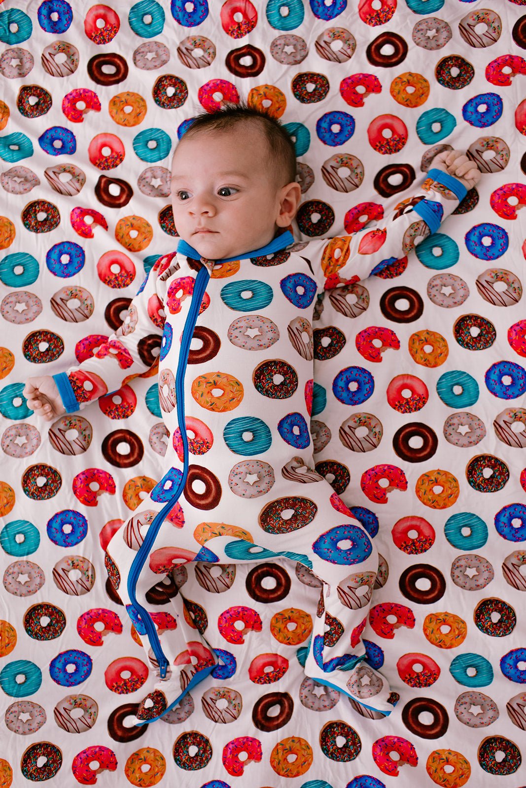 Baby footie pajamas in a playful chicken print with a full-length front zipper.