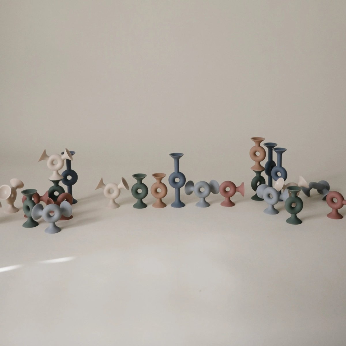 Mushie Donut Silicone Suction Builder Toys Set of 18 Non-Toxic Flexible Creativity Stacking Playtime Bath Time -