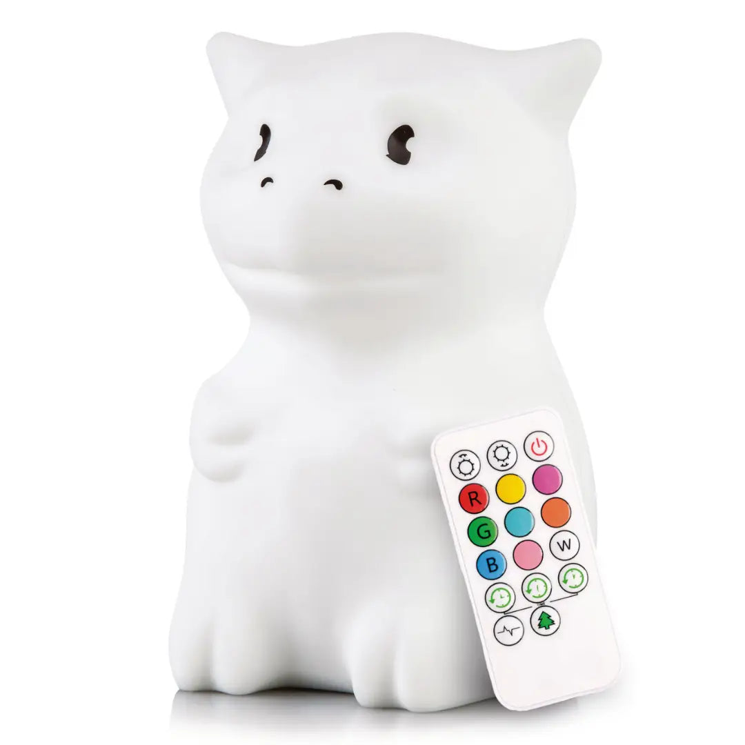 Dragon-shaped silicone night light for kids glowing softly on a nursery surface