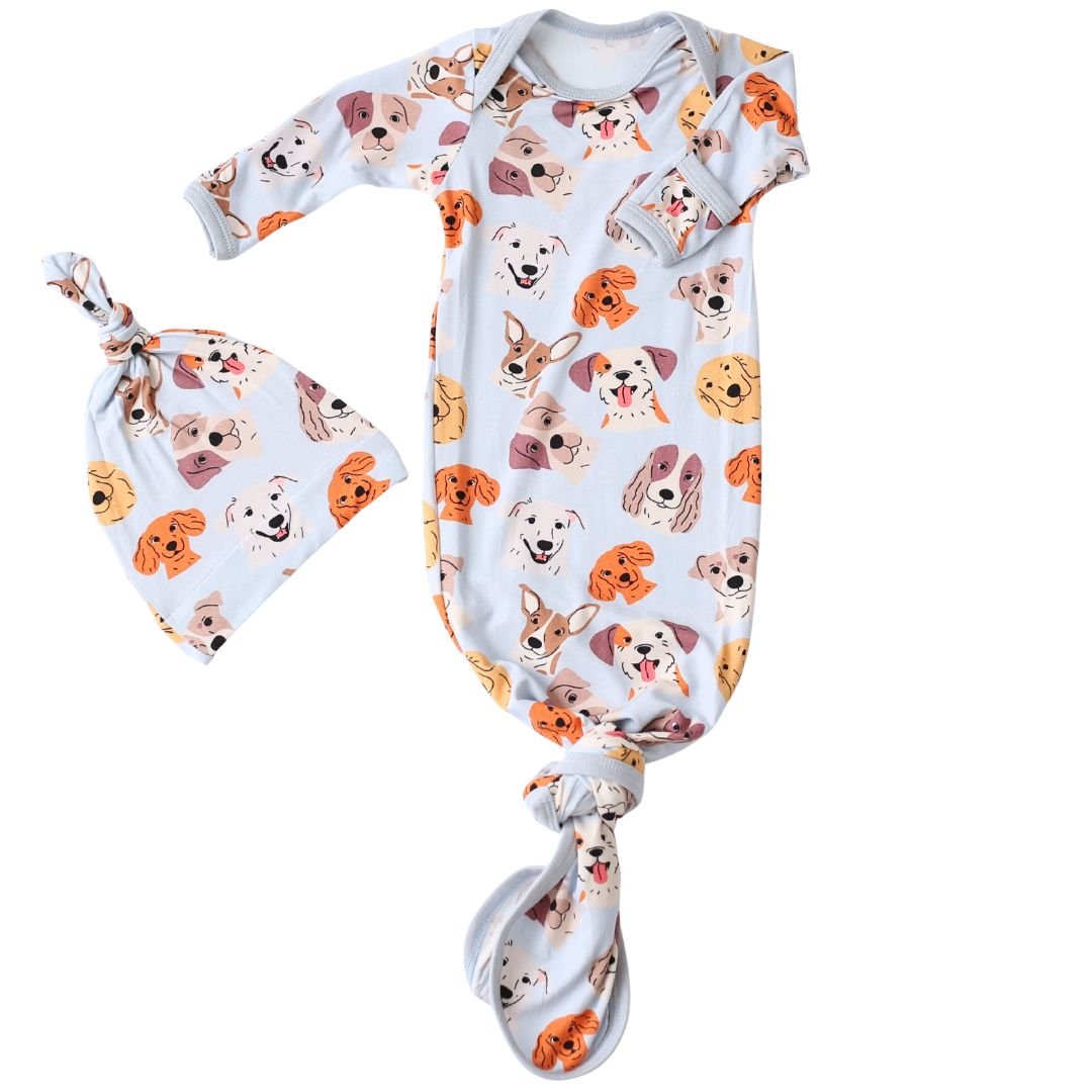 Baby knot gown and matching hat in white with a dog print, featuring fold-over hand mittens.