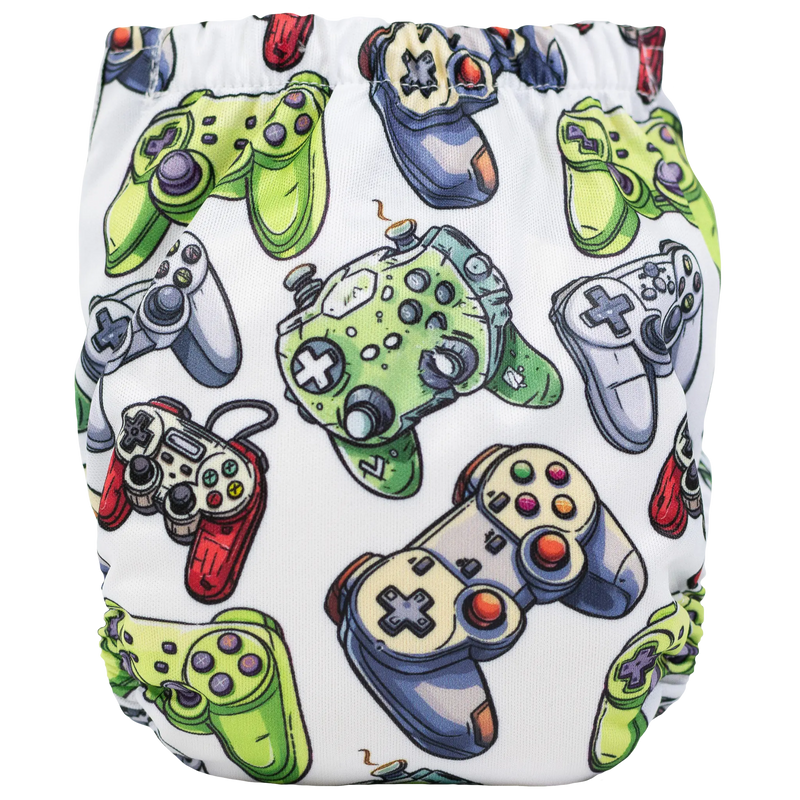 Tiny Tushies Newborn AIO Cloth Diaper with colorful game controller print, designed for babies 5-20 lbs.