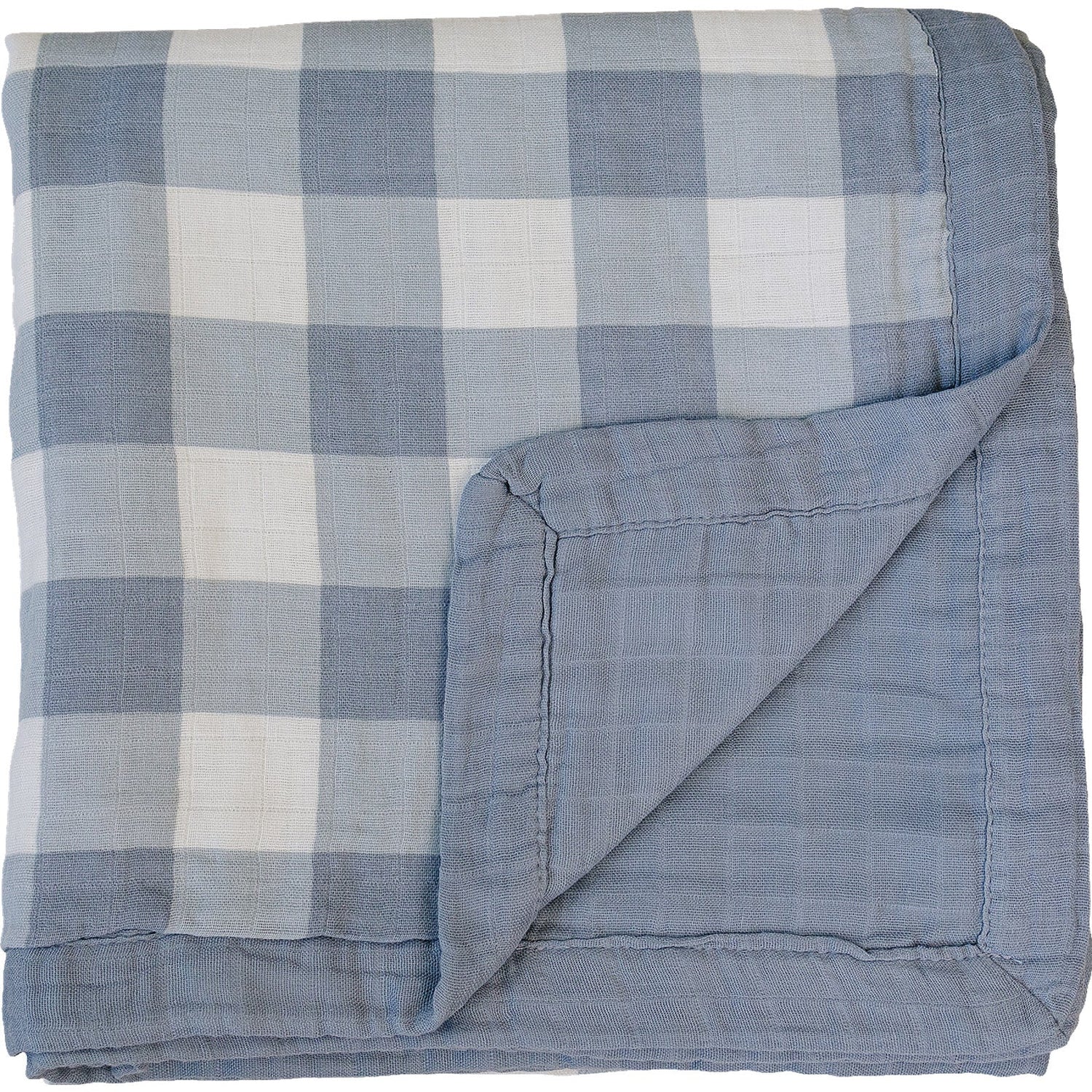 Muslin quilt with dusty blue gingham on one side and solid dusty blue on the reverse, laid flat